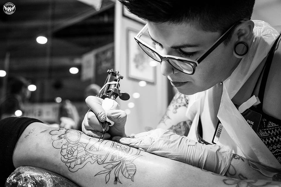 Tattoo artist tattooing clients arm in tattoo studio  Slow Motion   ClipStock
